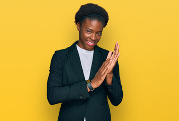 Poster - Young african american girl wearing business clothes clapping and applauding happy and joyful, smiling proud hands together