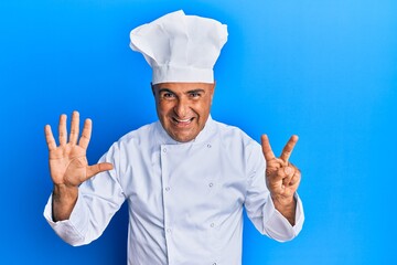 Mature middle east man wearing professional cook uniform and hat showing and pointing up with fingers number seven while smiling confident and happy.