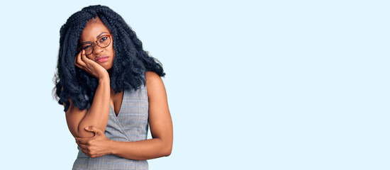 Beautiful african american woman wearing business dress and glasses thinking looking tired and bored with depression problems with crossed arms.