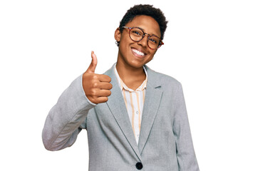 Young african american woman wearing business clothes doing happy thumbs up gesture with hand. approving expression looking at the camera showing success.