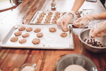 Girls bake oatmeal cookies at home