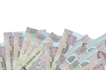 500 UAE dirhams bills lies on bottom side of screen isolated on white background with copy space. Background banner template