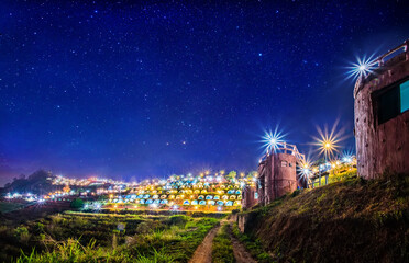 Wall Mural - the lights on the hill from the tourist tent at night