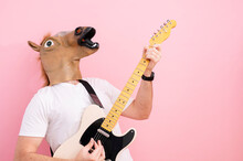 Man With Horse Mask Playing Electric Guitar