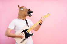 Man With Horse Mask Playing Electric Guitar