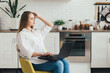 © irina_timokhina - Pregnant girl a freelancer working at home in the kitchen
