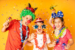 © Victor - Three kids celebrating Carnival or New Years Eve at home