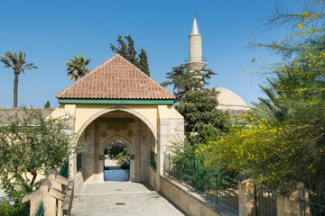 Wall Mural - The gate of the ancient mosque Hala Sultan Tekke or the Mosque of Umm Haram near the shore of the salt lake in Cyprus in Larnaca