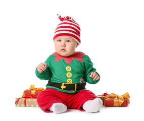 Cute little baby in elf's costume and with gifts on white background