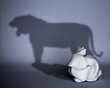 Concept of hidden potential. A paper figure of a rabbit that fills the shadow of a tiger. 3D illustration