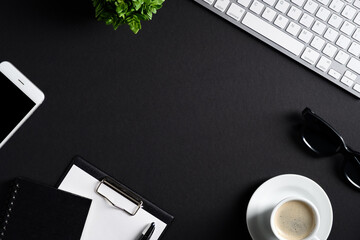 Fototapete - Black office desk table with computer keyboard, cup of coffee and supplies. Top view with copy space, flat lay. Luxury style workspace. Business concept.