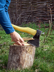 Man chopping firewood with an axe