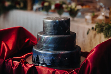 close-up of an unusual black wedding cake