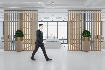 Poster - Businessman walking in clean ceo room with decorative wooden wall