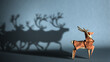 The concept of leadership, teamwork, focus and achievement of goals. A paper caribou figurine that casts the shadow of a large flock. 3D illustration