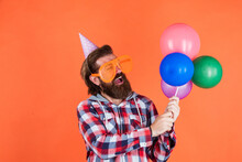 I Like It. Stylish Male Having Fun On Birthday. Bearded Man Celebrate Holiday. Anniversary. Surprise For Him. Event Manager With Gift. Mature Guy In Checkered Shirt With Party Balloons