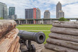 TORONTO, ONTARIO, CANADA- MAY 27, 2017: Cannon in Fort York National Historic Site with city in background, Canada's largest collection of original War of 1812 buildings and 1813 battle site.