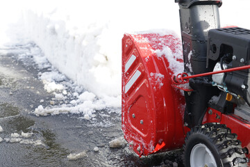 Wall Mural - close up on snow blower removing snow on the street