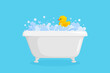 Bathtub with rubber duck in suds. Yellow duck in bubbles and foam isolated in blue background. Vector illustration in cartoon style
