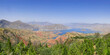 Beautiful panoramic view of Nurek dam lake on the Vakhsh river, second highest in world between Dushanbe and Khatlon regions in Tajikistan with trees foreground