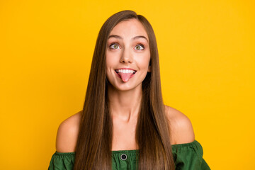 Close-up portrait of attractive cheerful funky brown-haired girl fooling grimacing isolated over bright yellow color background