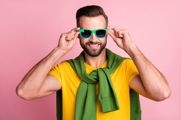 Poster - Photo of young man hold hands wear sunglass tight jumper good mood isolated on pink color background