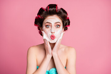 Poster - Close-up portrait of attractive amazed housewife applying mousse on face pout lips isolated on pink pastel color background