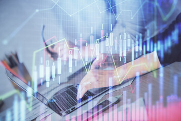  Multi exposure of woman hands typing on computer and financial chart hologram drawing. Stock market analysis concept.