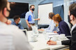 © Robert Kneschke - Business coach makes presentation on the whiteboard