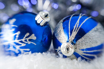 Christmas decoration - blue christmas ball on the lights backgrou