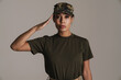 © Drobot Dean - Confident african american soldier woman saluting and looking at camera