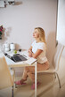 © Svitlana - Charming blonde Caucasian business woman spending time at the modern laptop in the indoors