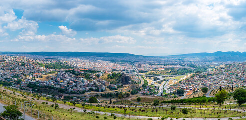 Buca District and Ataturk Mask view from Kadifekale Castle in Izmir City.