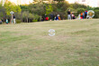 © zz3701 - A soap bubble flying in the park with tree and meadow in autumn near a residential area