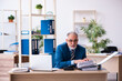 © Elnur - Old male bookkeeper unhappy with excessive work at workplace