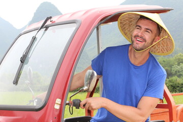 Caucasian tourist renting tuk tuk in Asia