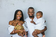 © Ursula Page - A beautiful African-American young family with two children. The oldest son is a toddler and the new infant newborn son is only a few weeks old.