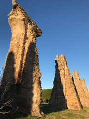 Poster - Roman aqueduct ruins in Frejus France against blue sky