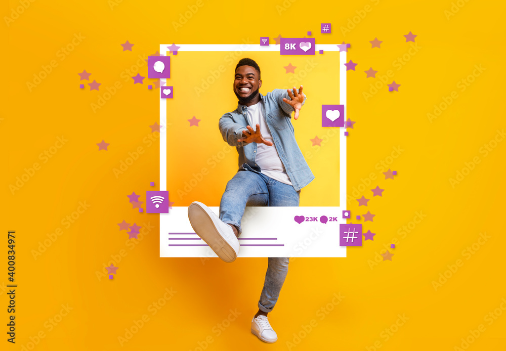 African American guy dancing and jumping out of photo frame on yellow background, collage with social media reactions - obrazy, fototapety, plakaty 