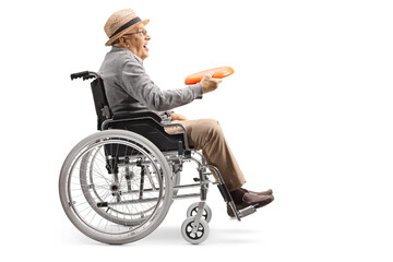 Poster - Full length profile shot of an elderly man in a wheelchair holding a throwing plastic disk