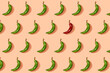 © gemma ferrando & jeremie roman/Westend61 - Pattern of green chili peppers with single red one