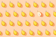 Pattern Of Fresh Yellow Pears With Single Halved One