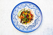 © Larissa Veronesi/Westend61 - Bowl of Mexican rice with tomatoes, bell pepper, tofu, kidney beans, corn, scallion and lime