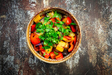 Bowl Of Grilled Eggplants And Bell Peppers With Parsley