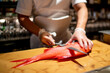 © Oscar Carrascosa Martinez/Westend61 - Chef cutting fish on cutting board in commercial kitchen at restaurant