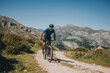 © Photographer: David Molina Grande/Westend61 - Male cyclist riding mountain bike on trail against sky, Picos de Europa National Park, Asturias, Spain