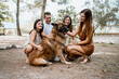 © Rafa Cort√©s/Westend61 - Smiling family with dog in park