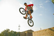 © Westend61 - Young Asian man doing mid-air stunt on BMX bike against sky, Hero's Square, Budapest, Hungary