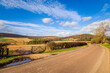 © ¬© Flavia Morlachetti/Westend61 - Empty country road in rural landscape on sunny day