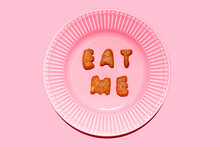 Plate With Biscuit Letters Arranged Into Message Eat Me
